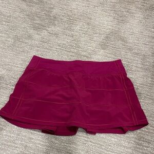 NWOT Lululemon pace rival skirt. Size 8. Magenta color.